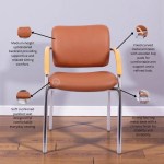 Brown visitor chair with cushioned seat, wooden armrests and chrome metal legs