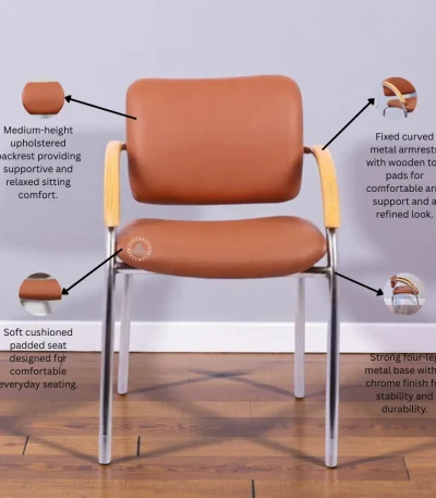 Brown visitor chair with cushioned seat, wooden armrests and chrome metal legs